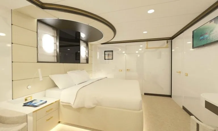 Lit blanc dans une cabine de luxe